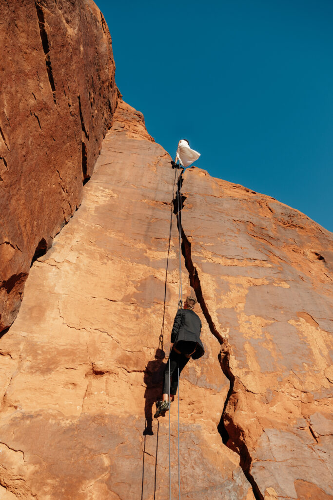 St. George Rappelling bridal session, red rock bridal session, St George bridal session, adventure bridals, red rock wedding photos, unique wedding photos Southern Utah 