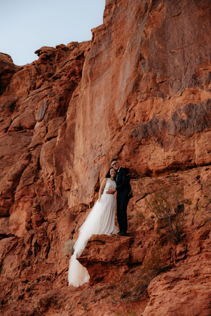 St. George Rappelling bridal session, red rock bridal session, St George bridal session, adventure bridals, red rock wedding photos, unique wedding photos Southern Utah 