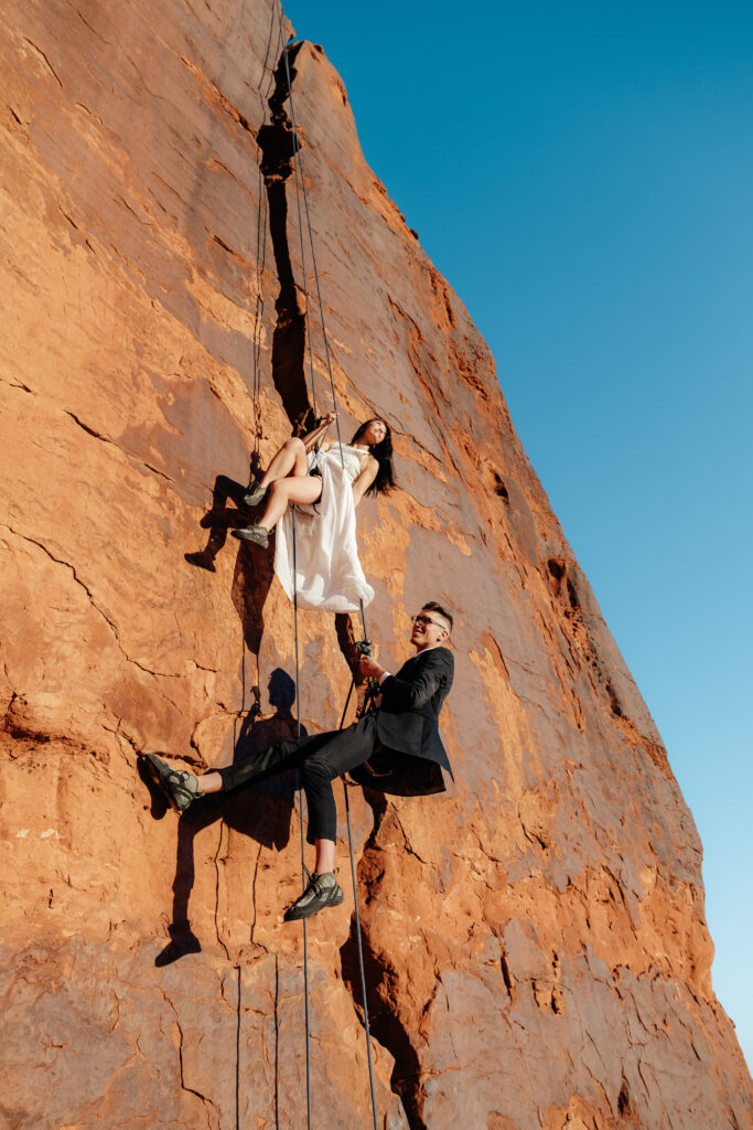 St. George Rappelling bridal session, red rock bridal session, St George bridal session, adventure bridals, red rock wedding photos, unique wedding photos Southern Utah 