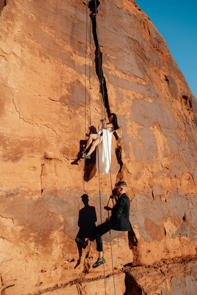 St. George Rappelling bridal session, red rock bridal session, St George bridal session, adventure bridals, red rock wedding photos, unique wedding photos Southern Utah 