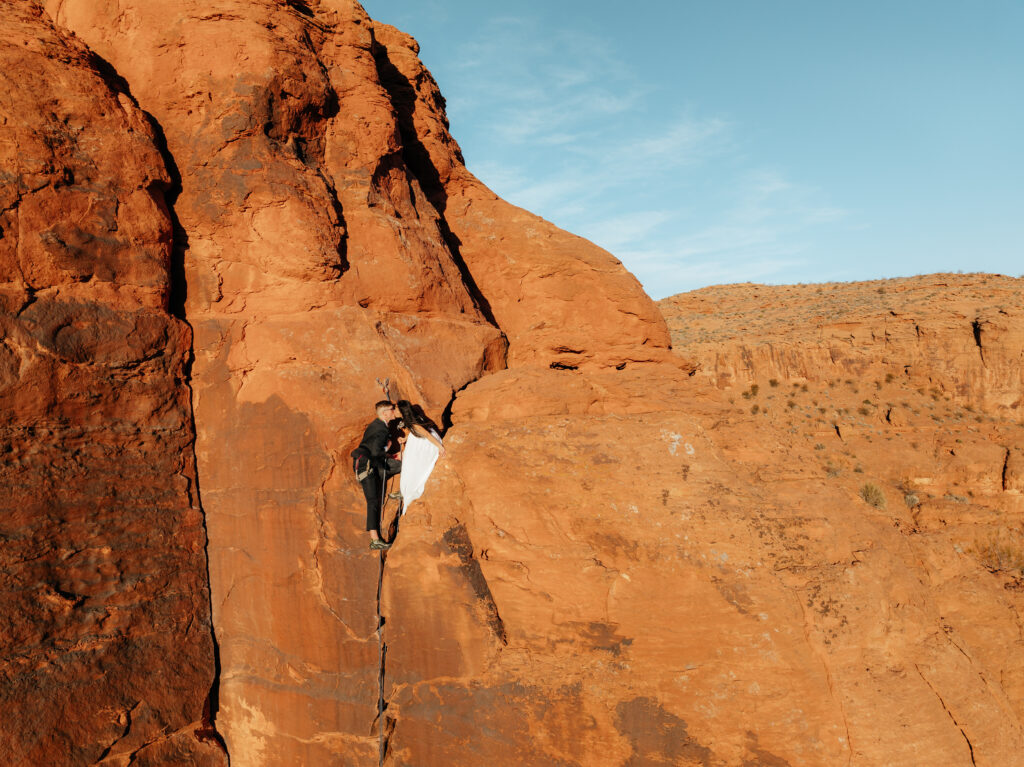 St. George Rappelling bridal session, red rock bridal session, St George bridal session, adventure bridals, red rock wedding photos, unique wedding photos Southern Utah 