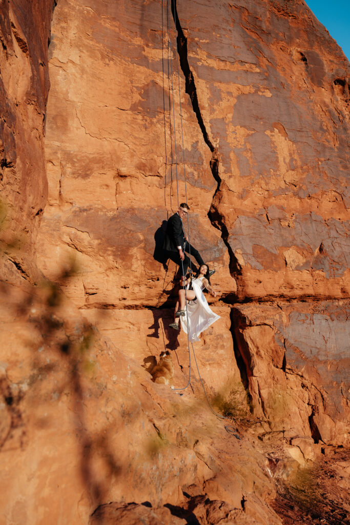 St. George Rappelling bridal session, red rock bridal session, St George bridal session, adventure bridals, red rock wedding photos, unique wedding photos Southern Utah 